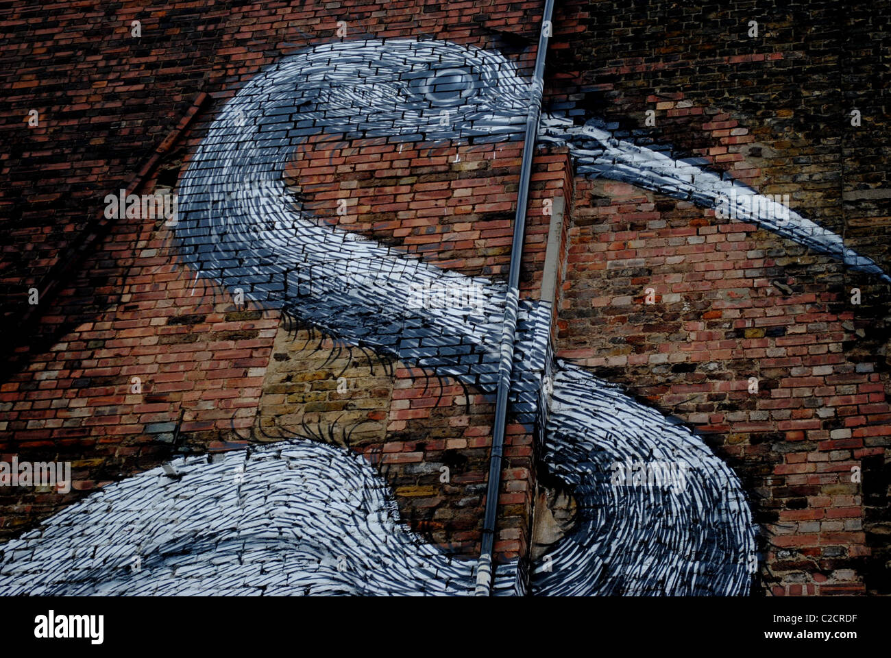 STREET ART IMAGE D'UNE GRUE DANS LE HANBURY Street LONDON E1 OFF BRICK LANE PAR ROA Banque D'Images