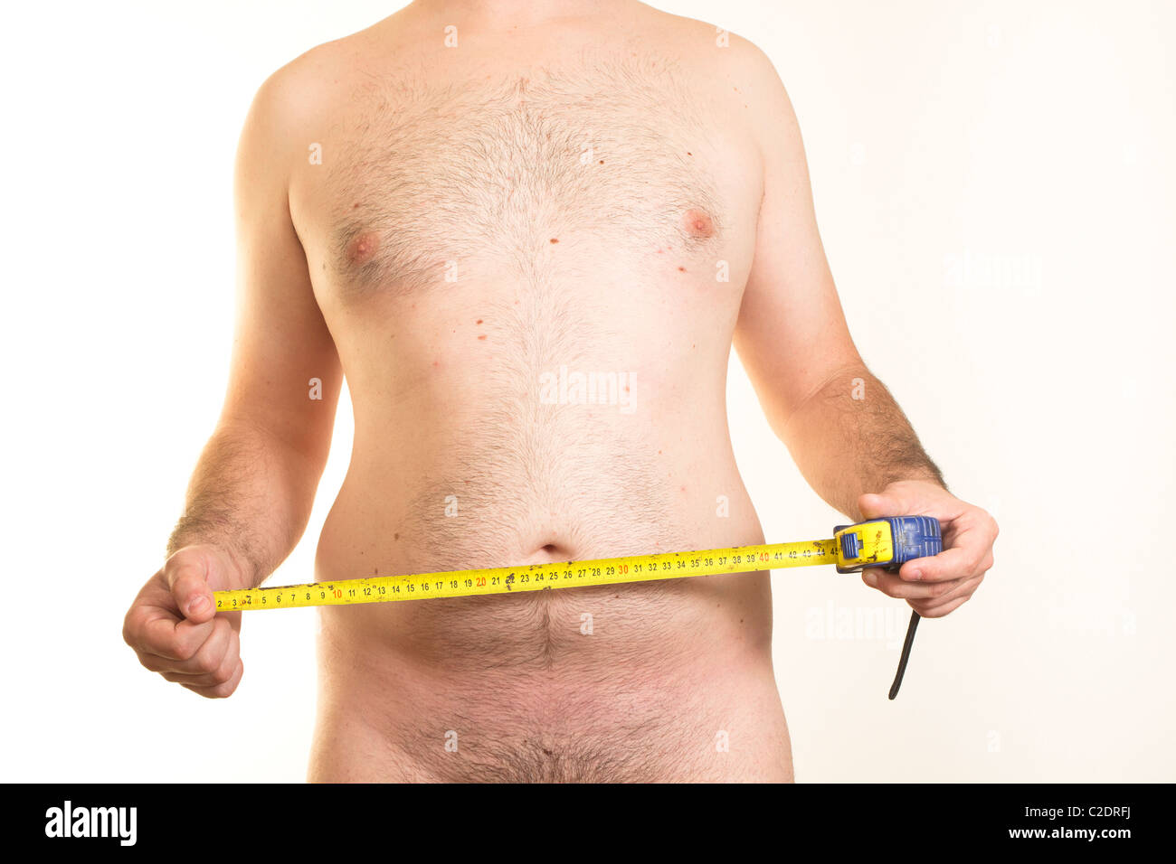Torse masculin à l'excès de ventre et ruban à mesurer en centimètres Banque D'Images