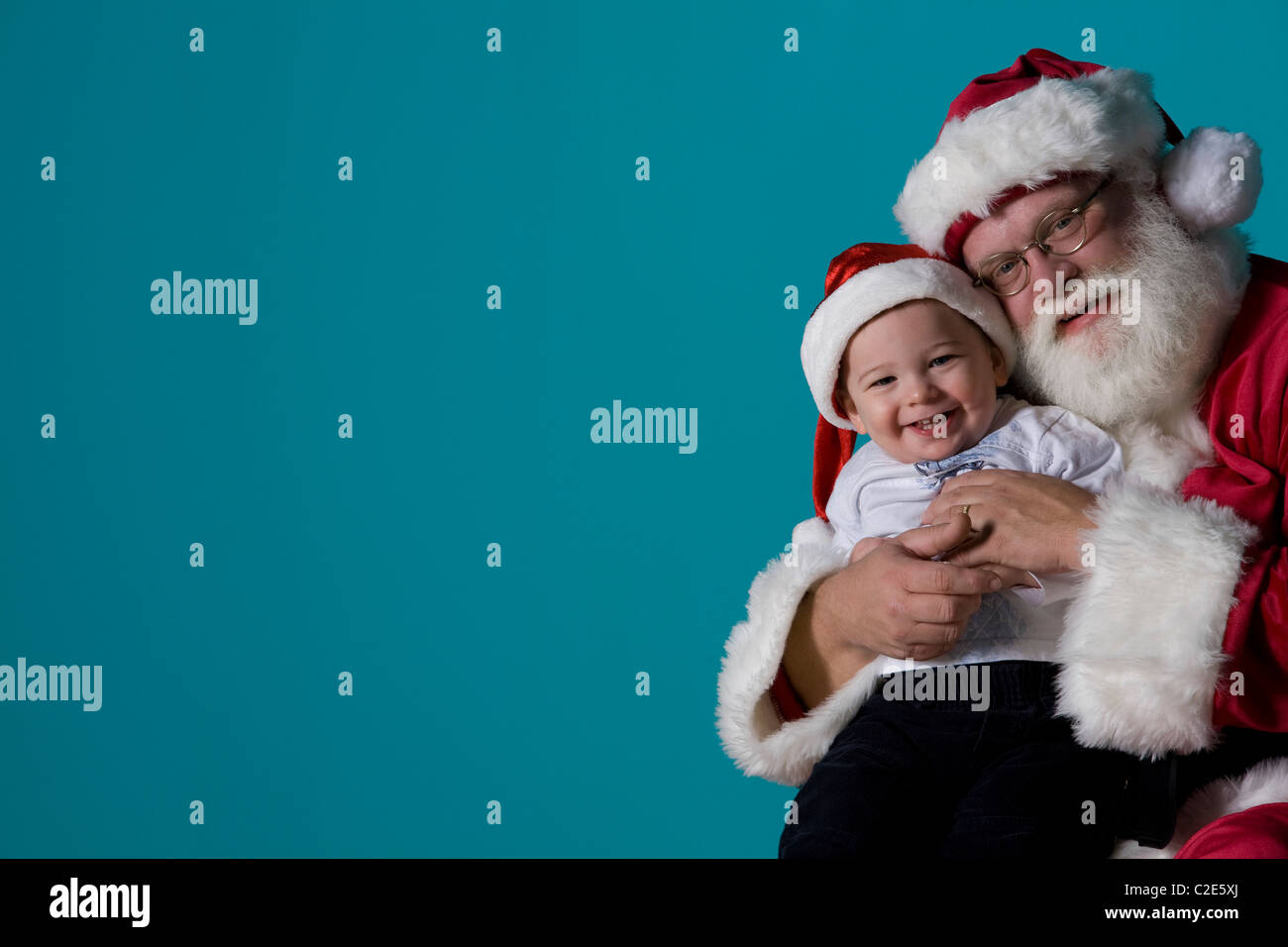 Portrait du Père Noël avec un bébé Banque D'Images