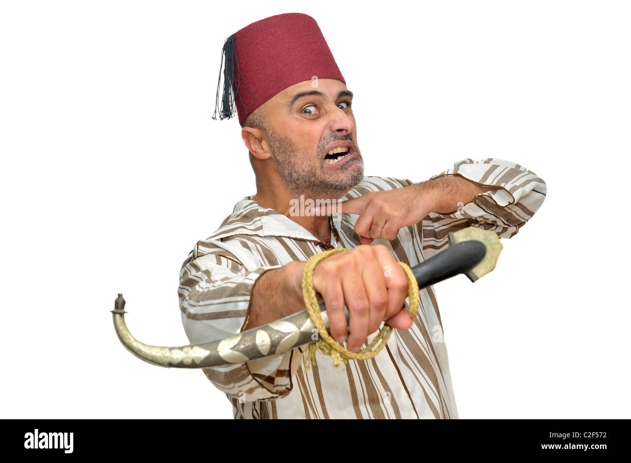 L'homme arabe avec un poignard making funny faces isolées dans White Banque D'Images