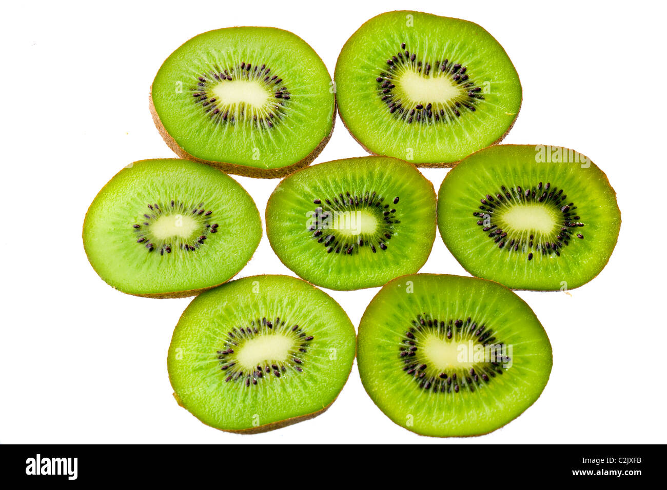 Tranches de kiwi vert isolated on white Banque D'Images