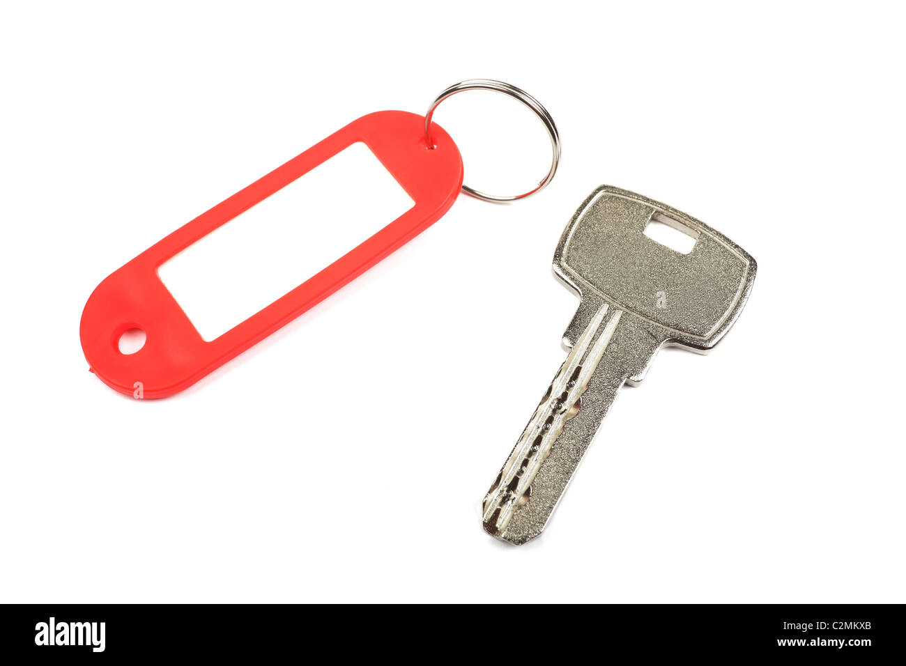 Key et rouge babiole avec vide pour votre conception de l'espace isolé sur fond blanc. Banque D'Images