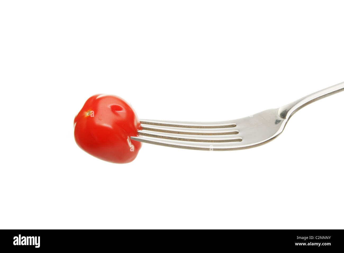 Un pomadorino tomate sur un tablier blanc isolé contre Banque D'Images