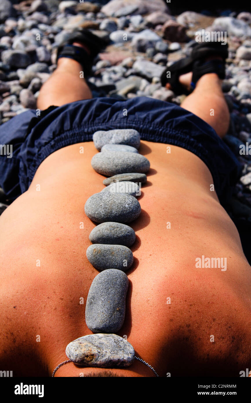 Rock spa pebble stone sex life massage santé nature basaltique la thérapie traditionnelle day spa calme calme sport jeunes abstraits objet Banque D'Images