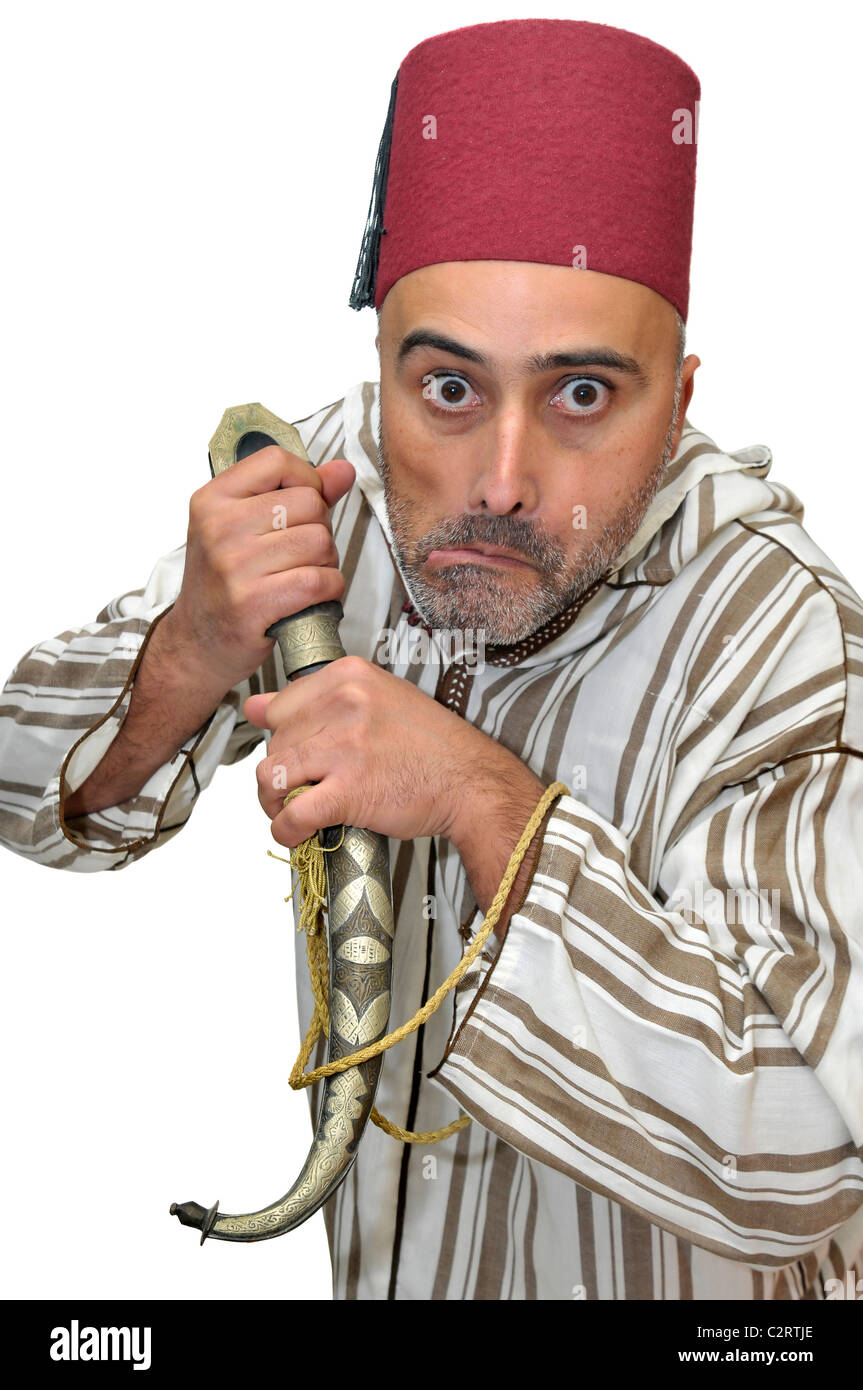 L'homme arabe avec un poignard making funny faces isolées dans White Banque D'Images