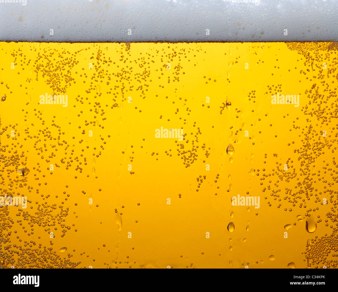 Bière légère en texture de verre Banque D'Images
