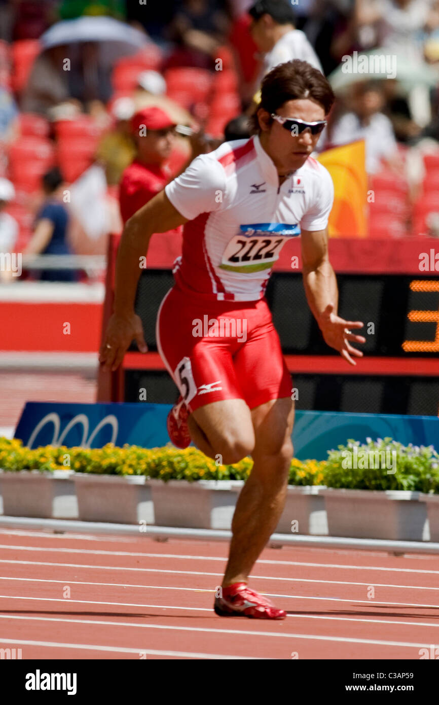 Naoki Tsukahara (JPN) en concurrence au premier tour des 100m au Jeux Olympiques d'été 2008, Pékin, Chine Banque D'Images
