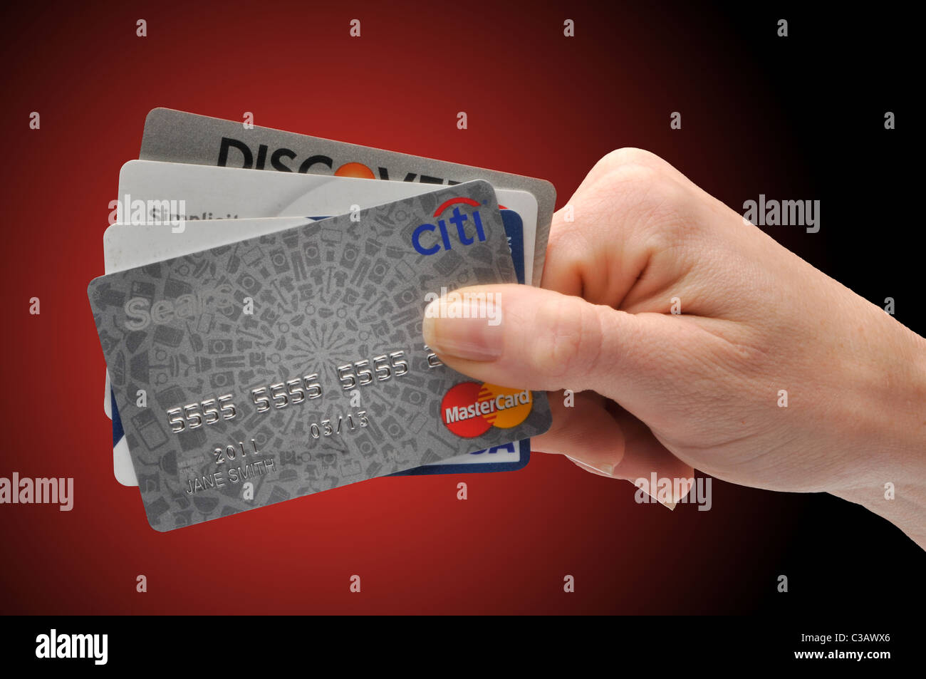 Femme hand holding credit cards Banque D'Images