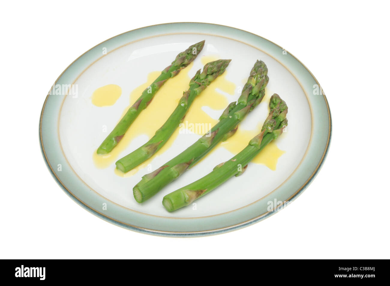 Asperges avec sauce hollandaise sur une plaque Banque D'Images