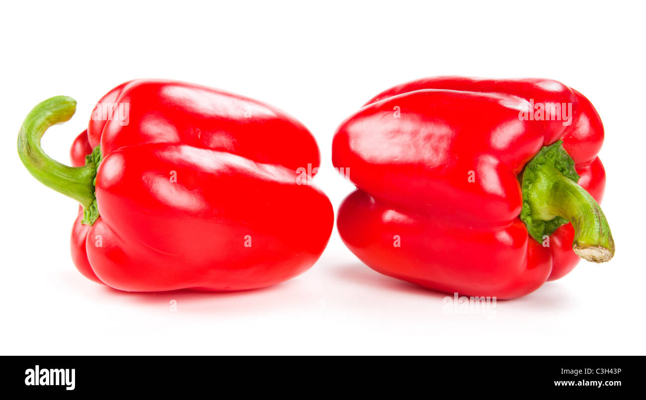 Deux poivrons rouges frais on white Banque D'Images