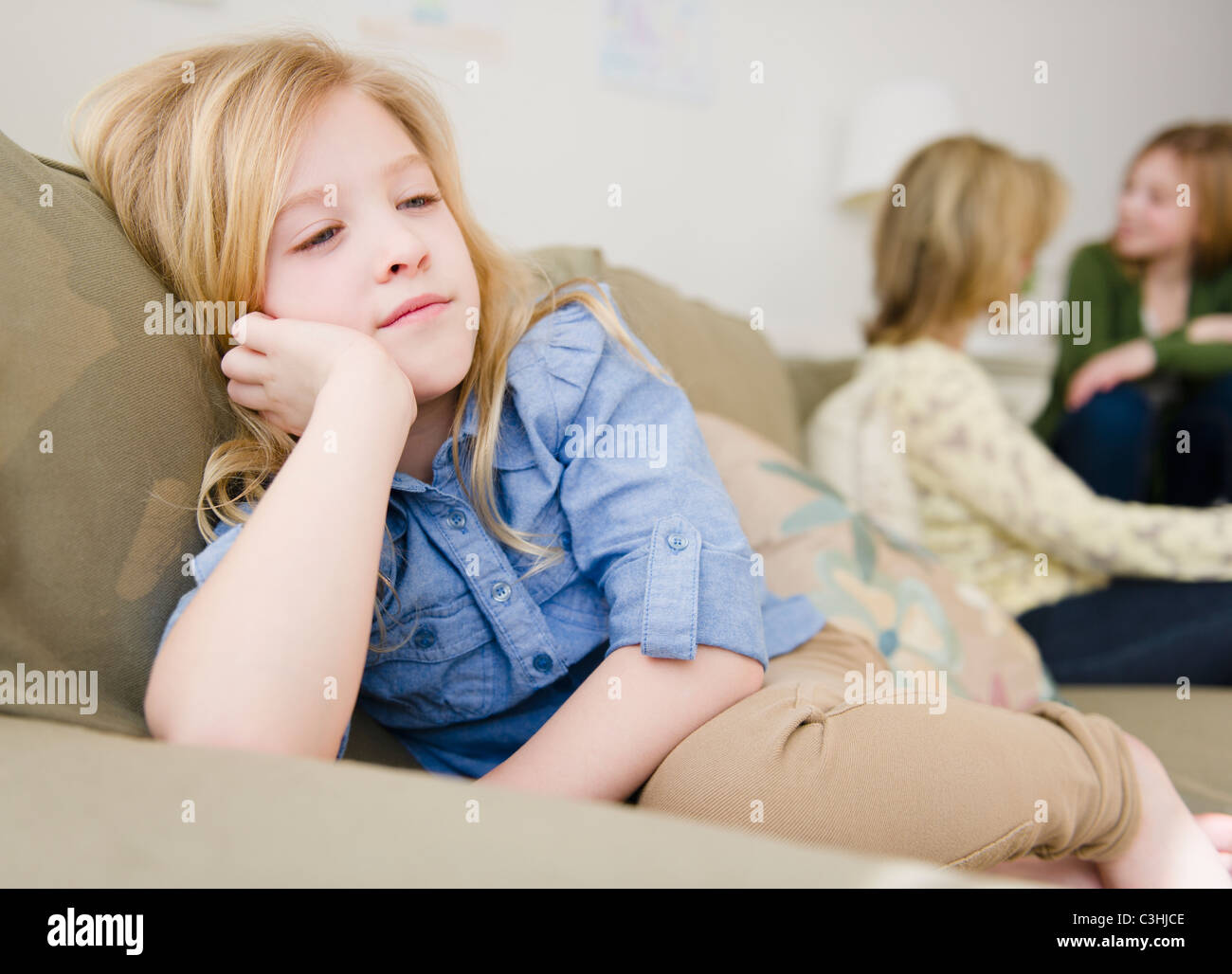 Girl sulking on sofa Banque de photographies et d’images à haute ...