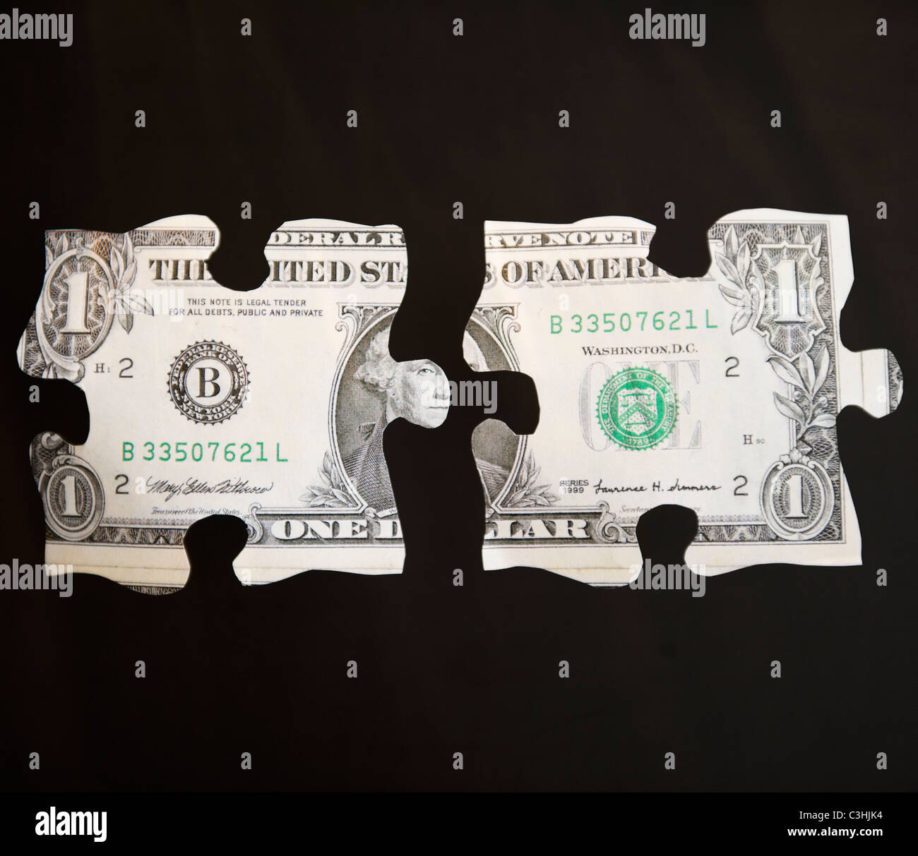 Studio shot de pièces de puzzle représentant un dollar bill Banque D'Images