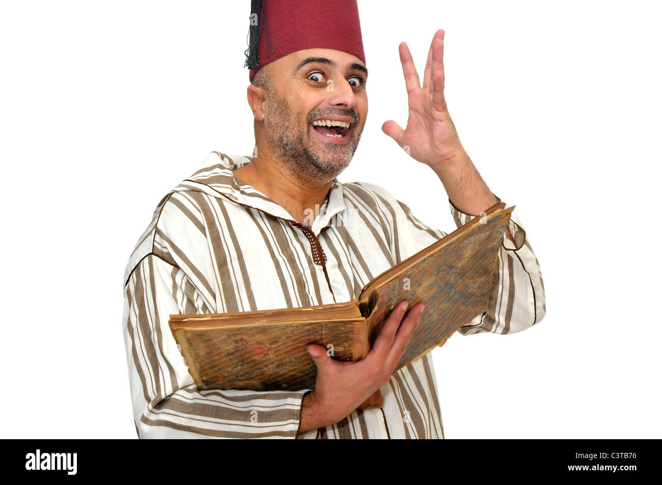 L'homme arabe avec de très vieux livre isolé dans White Banque D'Images