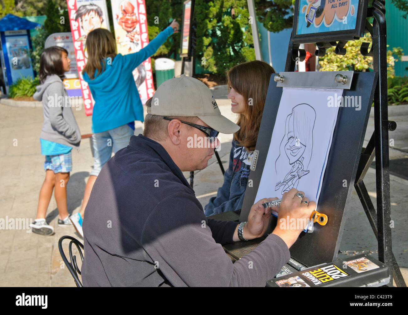 Une caricature en cours d'élaboration d'une fille à SeaWorld. Banque D'Images