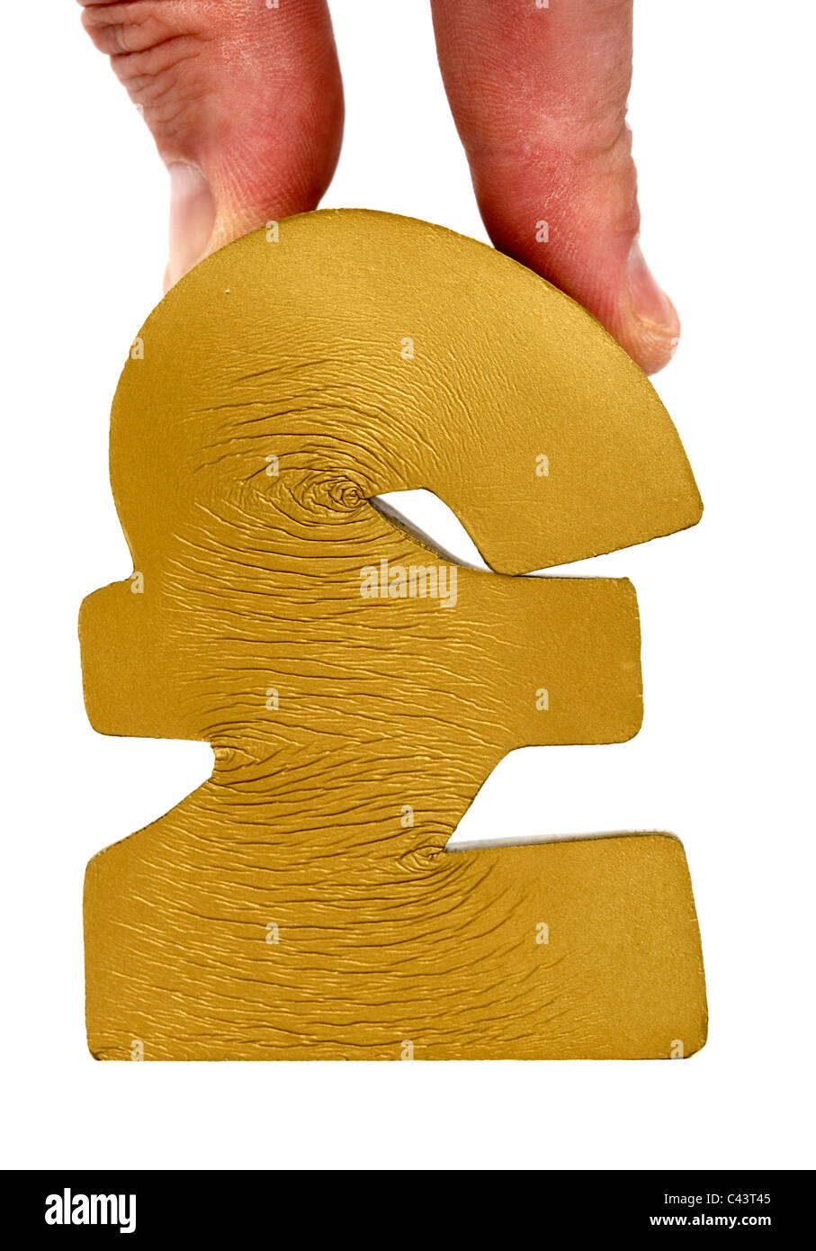 Mans doigts appuyant sur la flexibilité du British pound symbol Banque D'Images