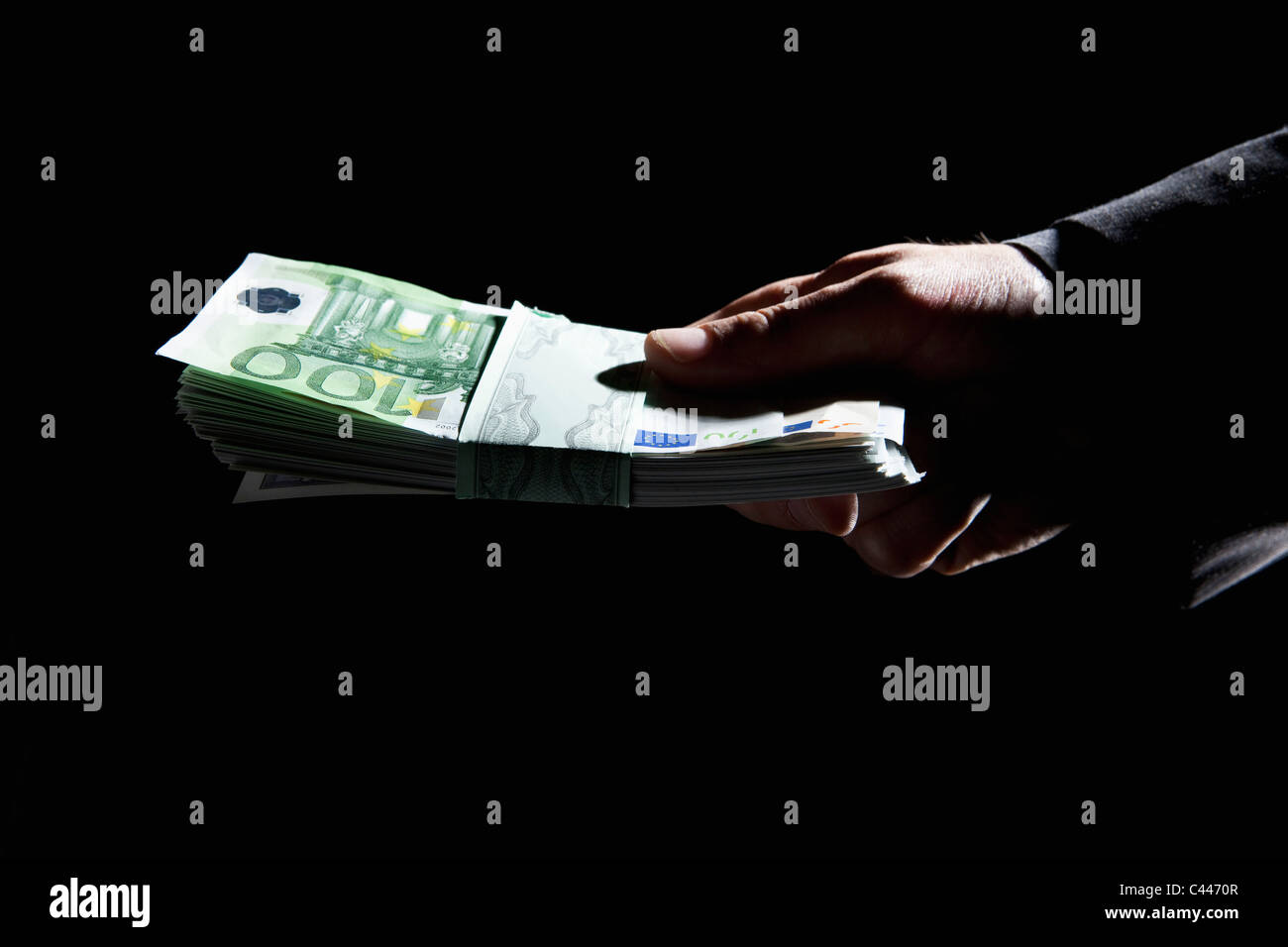 Hand holding pile d'argent Banque D'Images