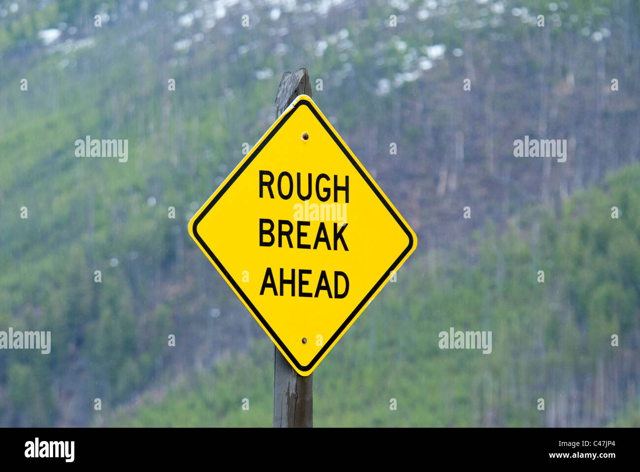 Pause "rude" signe de route dans le Parc National de Yellowstone USA Banque D'Images