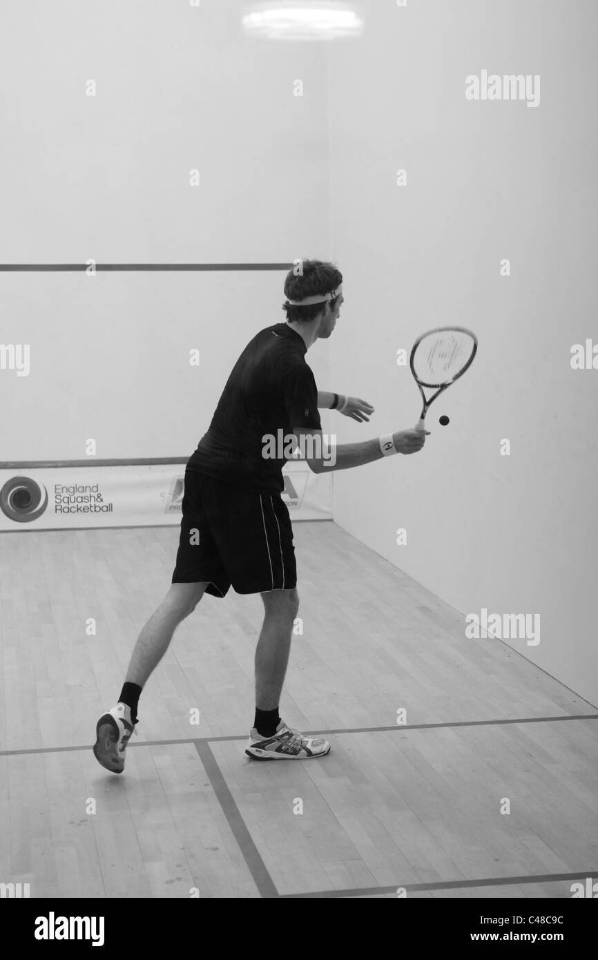 Squash Player servant Banque D'Images