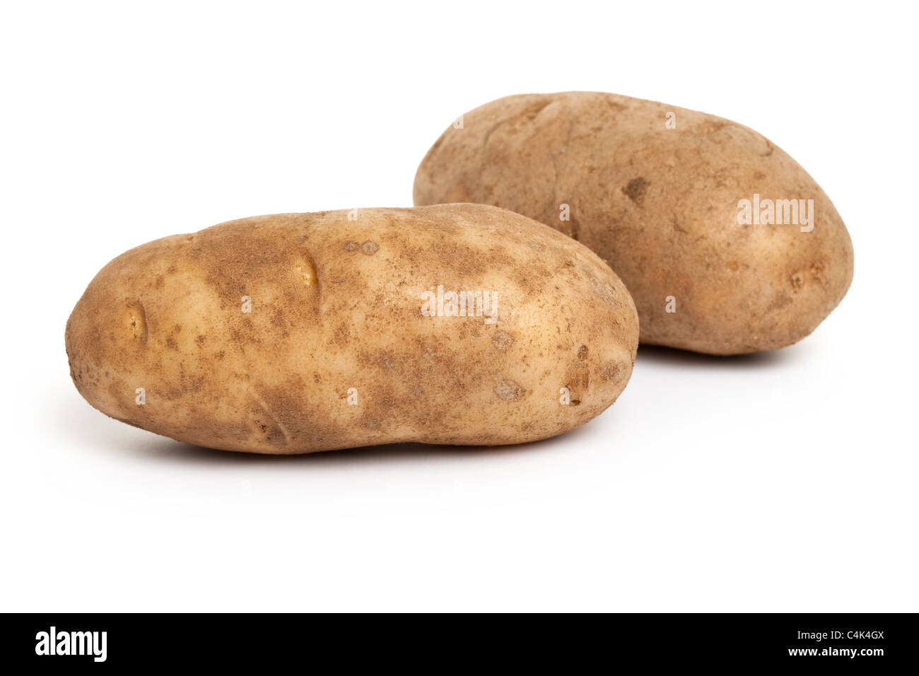 De pommes de terre roussâtres avec fond blanc Banque D'Images