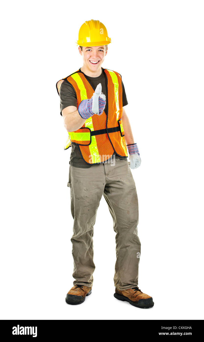 Smiling male construction worker showing Thumbs up in hard hat et gilet de sécurité Banque D'Images