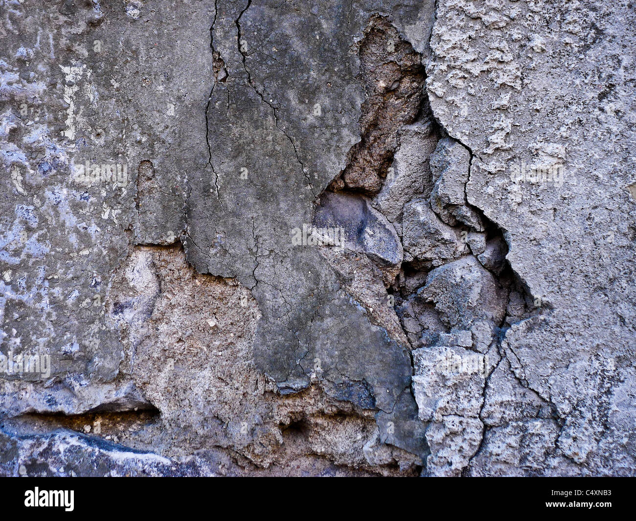 Fracture de crack in stone mur de ciment. Banque D'Images