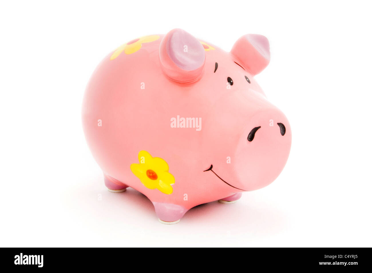 Pink Piggy Bank avec des fleurs jaunes sur fond blanc Banque D'Images Pink Piggy Bank avec des fleurs jaunes sur fond blanc Banque D'Images