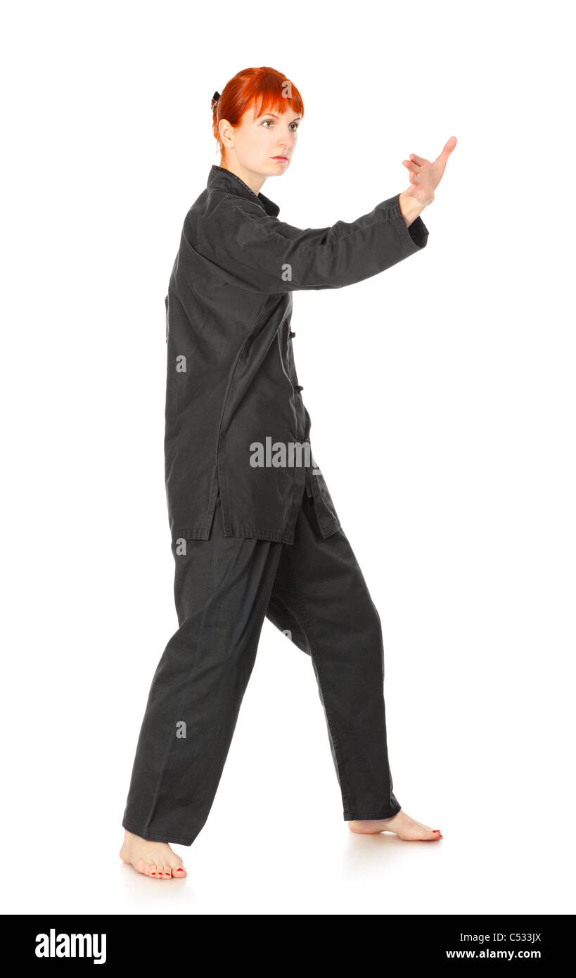 Fille en kimono noir, exercice isolated on white Banque D'Images