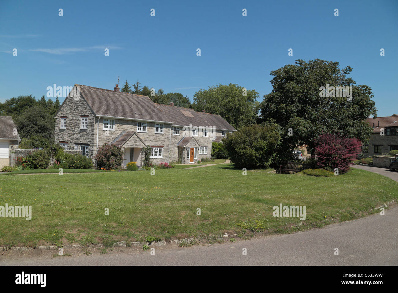 Jolies maisons en pierre gris vêtu dans Walditch, Bridport, Dorset, Angleterre. Banque D'Images