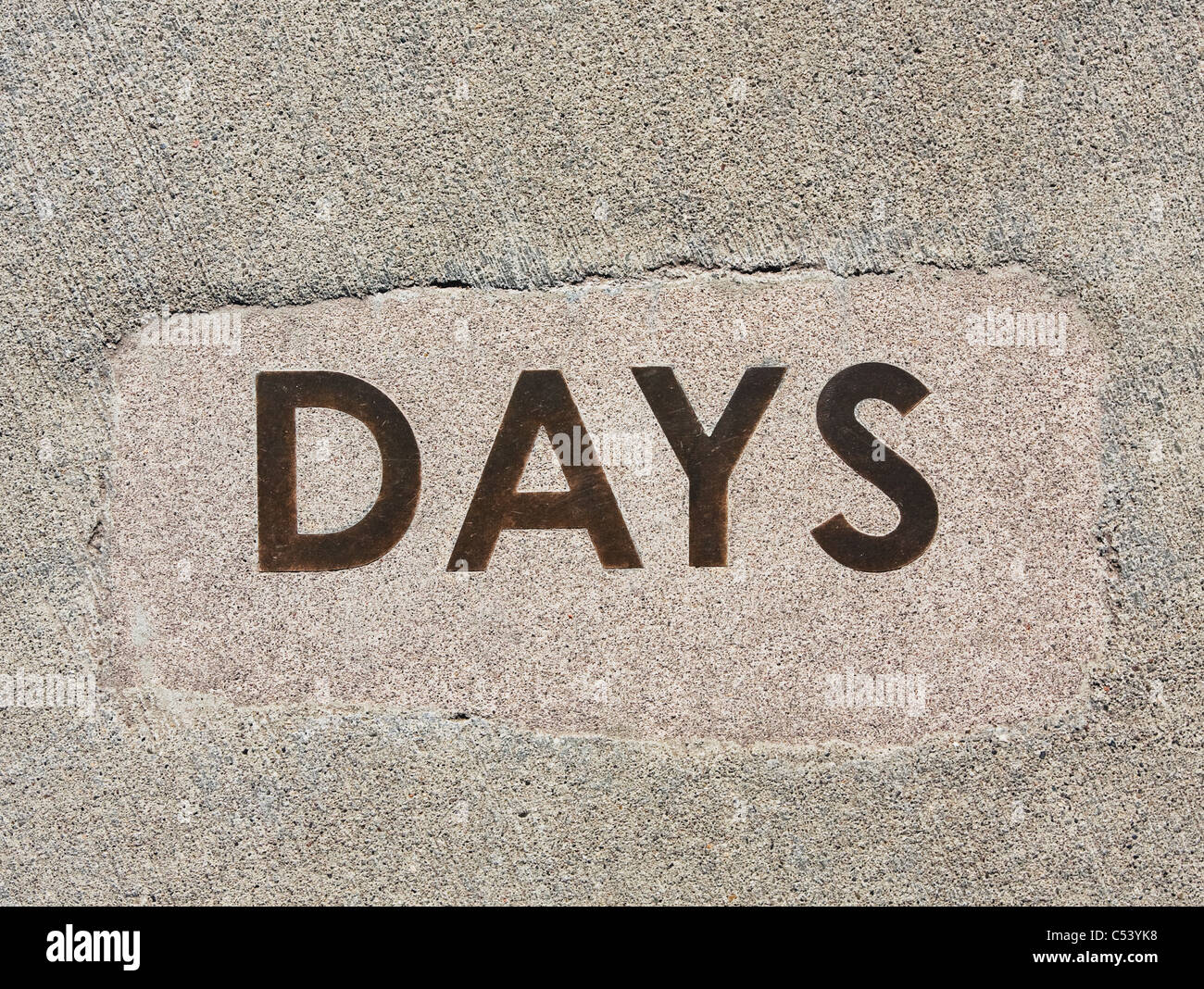 Mot jours coulés dans le béton Banque D'Images