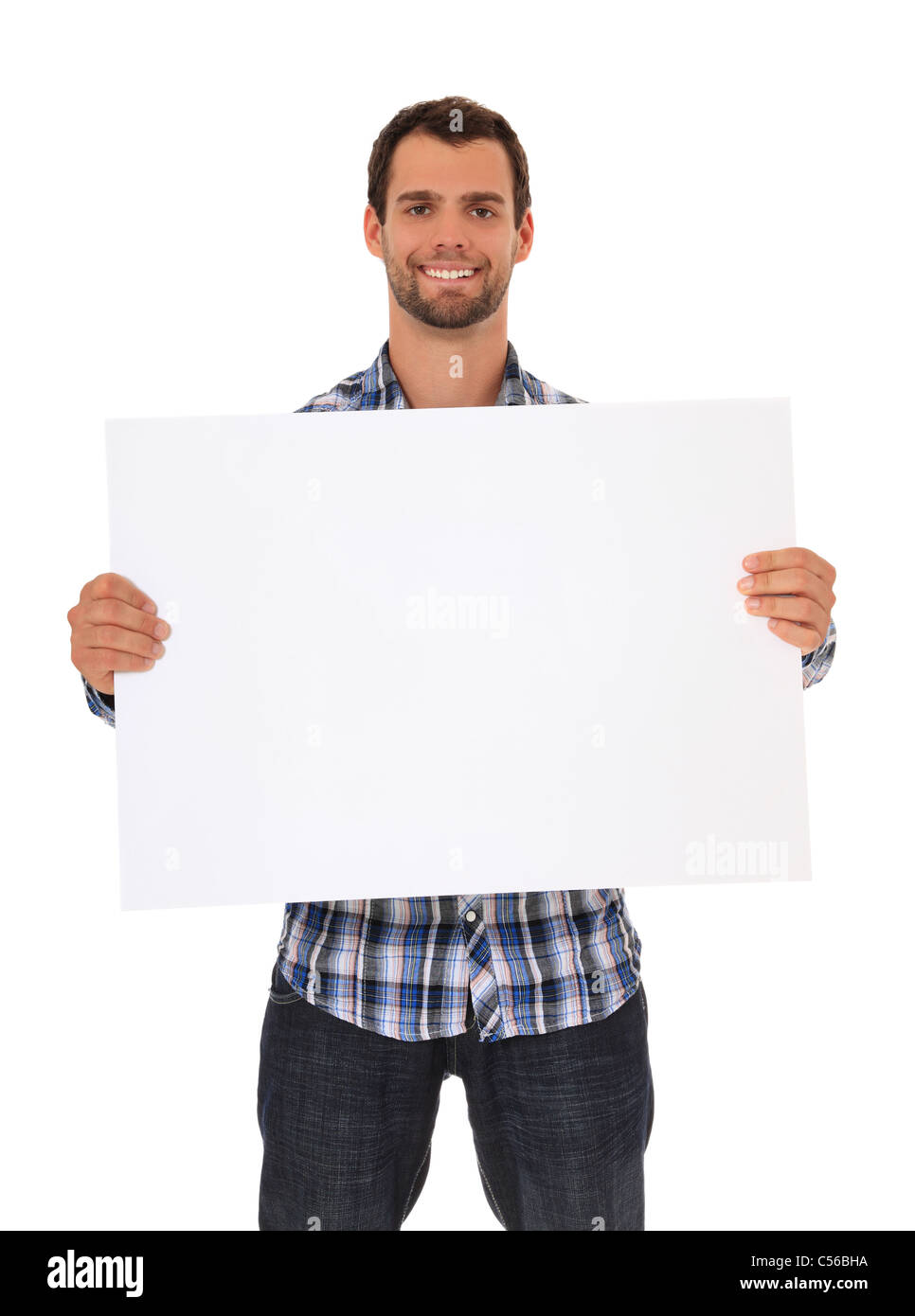 Young man holding blank sign. Le tout sur fond blanc. Banque D'Images