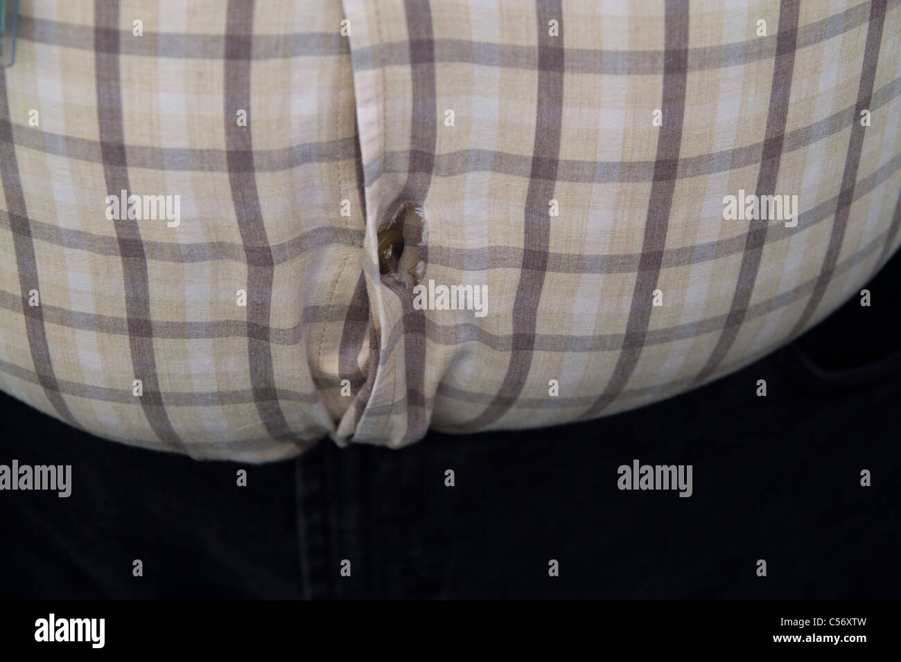 Fat Man bouton chemise rip Banque D'Images