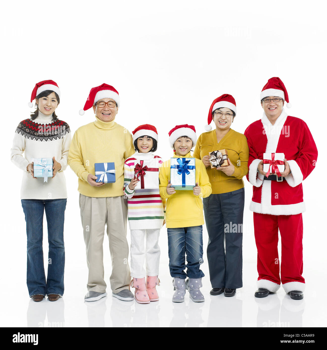 Portrait de famille bénéficiant de Noël dans l'habillement, smiling Banque D'Images