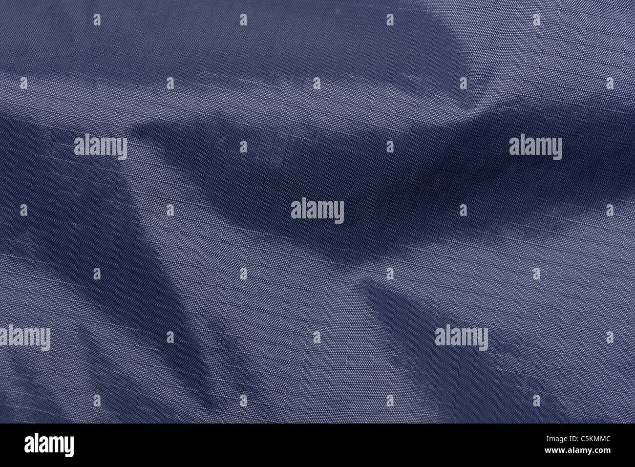 Matériau étanche détail close-up de ripstop nylon matériel sur un Peter Storm Stormtech imperméable gamme cagoule. Banque D'Images