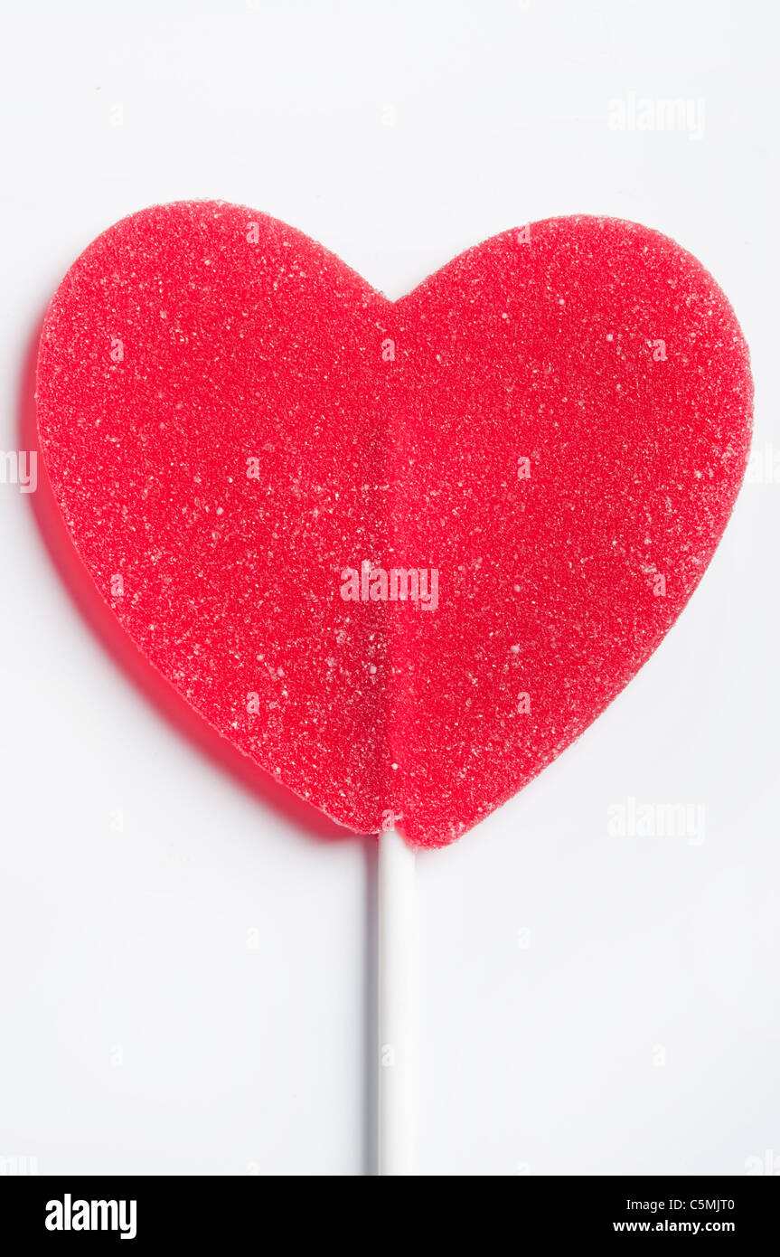 Sucette rouge en forme de coeur, l'amour concept Banque D'Images