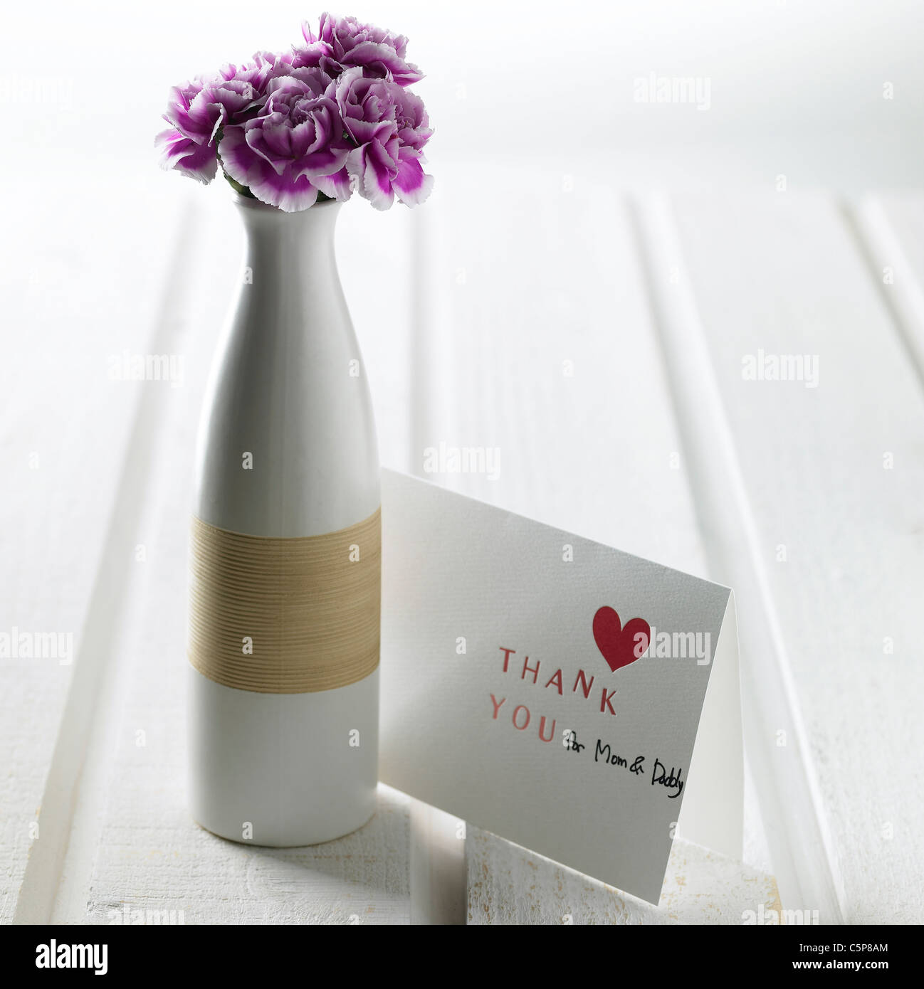 Vase à fleurs et carte de remerciement Banque D'Images