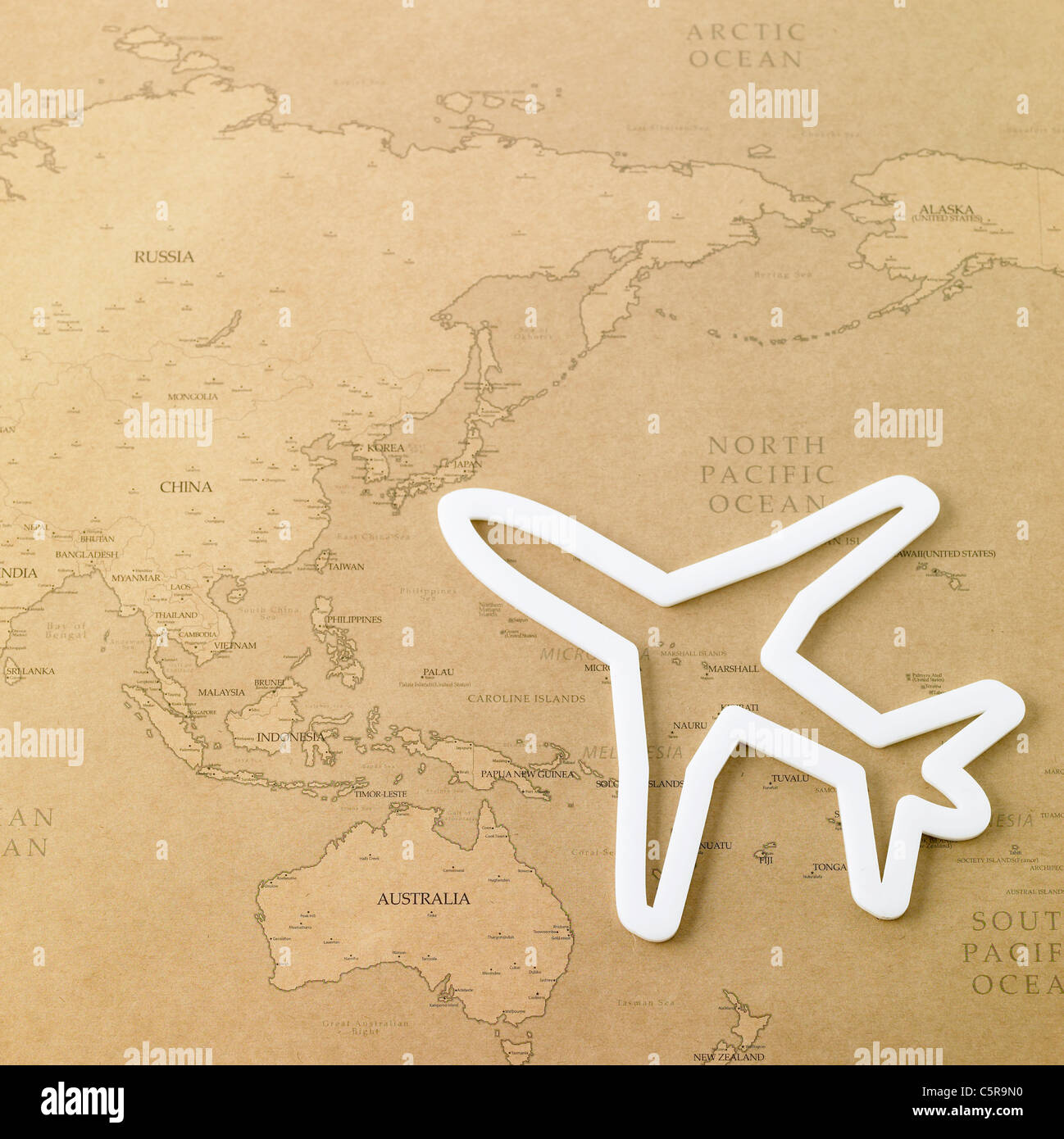 La figure de l'avion sur une carte du monde Banque D'Images