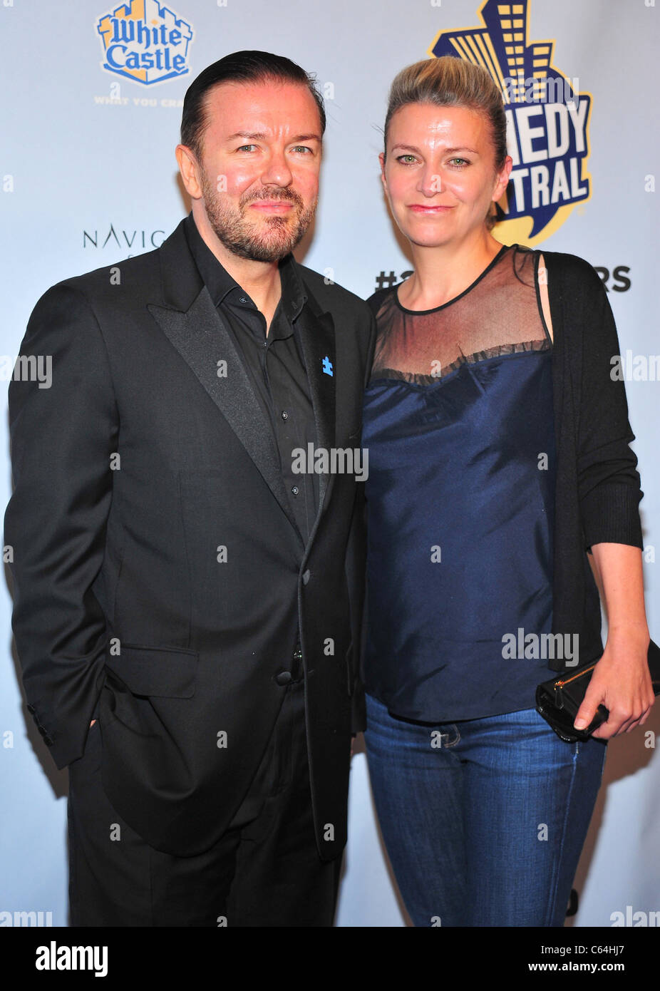 Rick Gervais with jane Fellow and Ashley Johnson and husband - Invention Of  Lying premiere at the Chinese Theatre in Los Angeles Stock Photo - Alamy