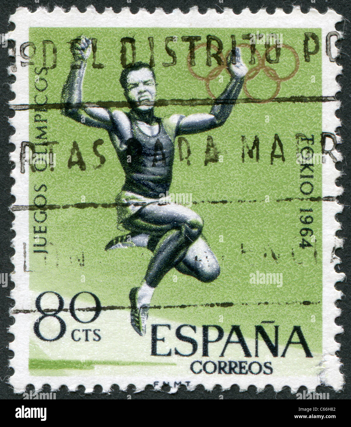 Espagne - 1964 : timbre imprimé en Espagne, est dédié à l'occasion des Jeux Olympiques de Tokyo, le saut en longueur Banque D'Images