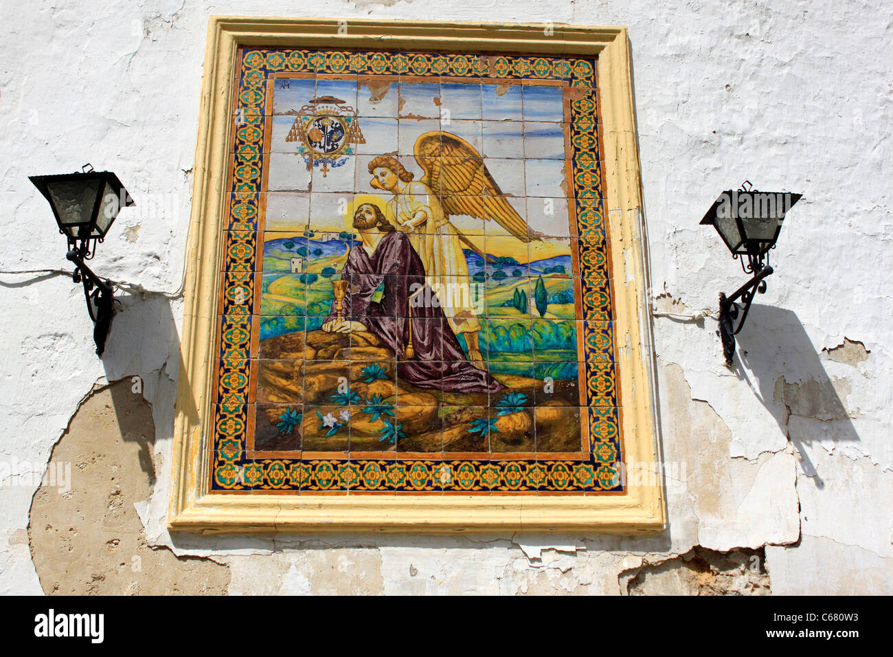 Carreaux de céramique décorée avec une image de Jésus Christ priant avec un ange est affiché à Jerez de la Frontera, Andalousie, Spa Banque D'Images