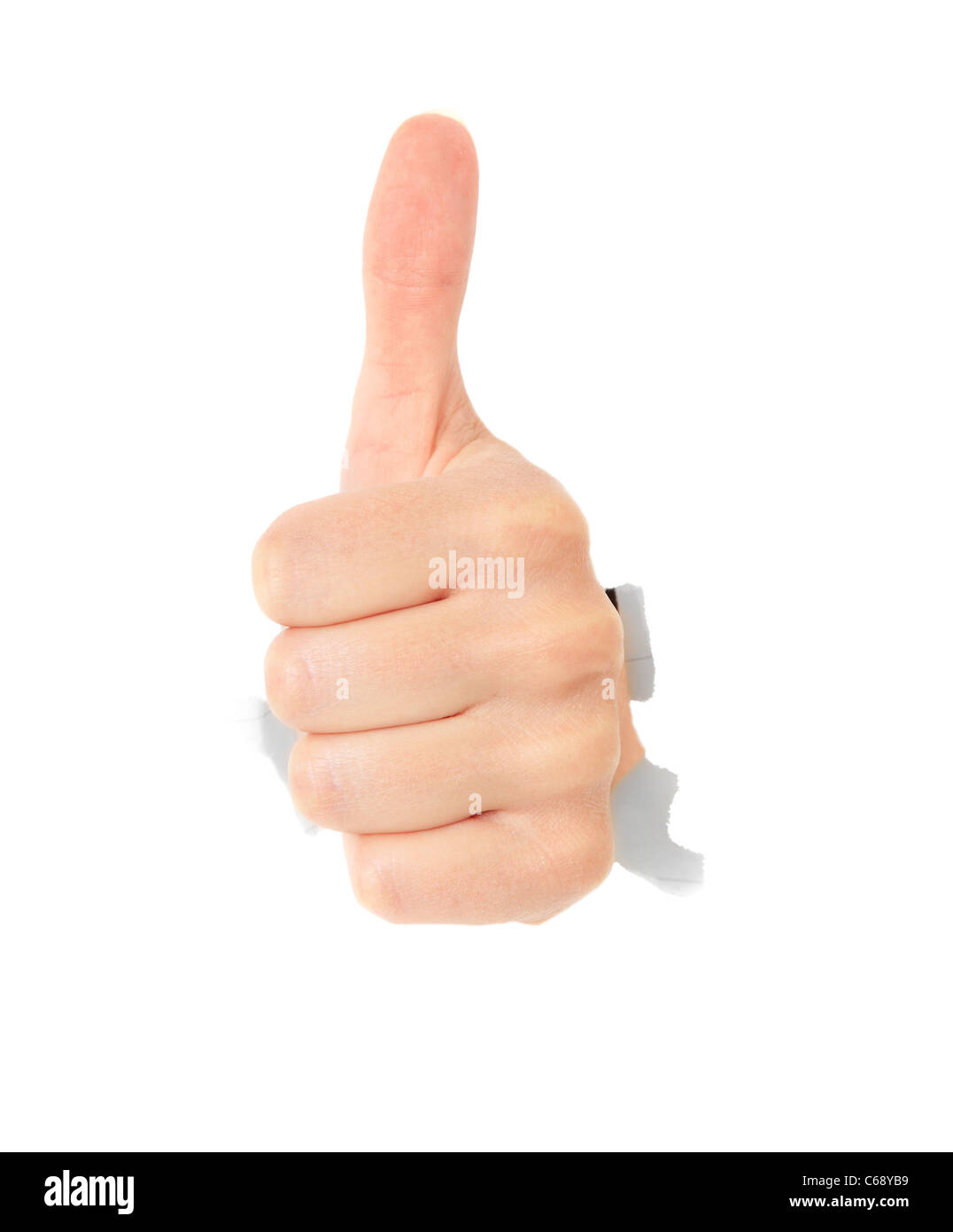 Hand showing thumb up déchiré de trou dans mur blanc. Le tout sur fond blanc. Banque D'Images