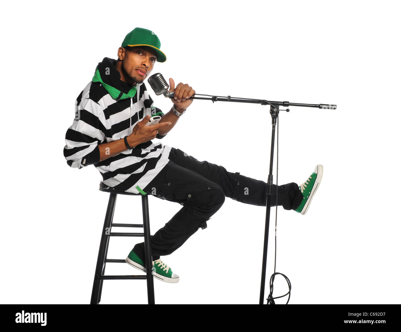 African American man singing into microphone vintage isolated over white background Banque D'Images