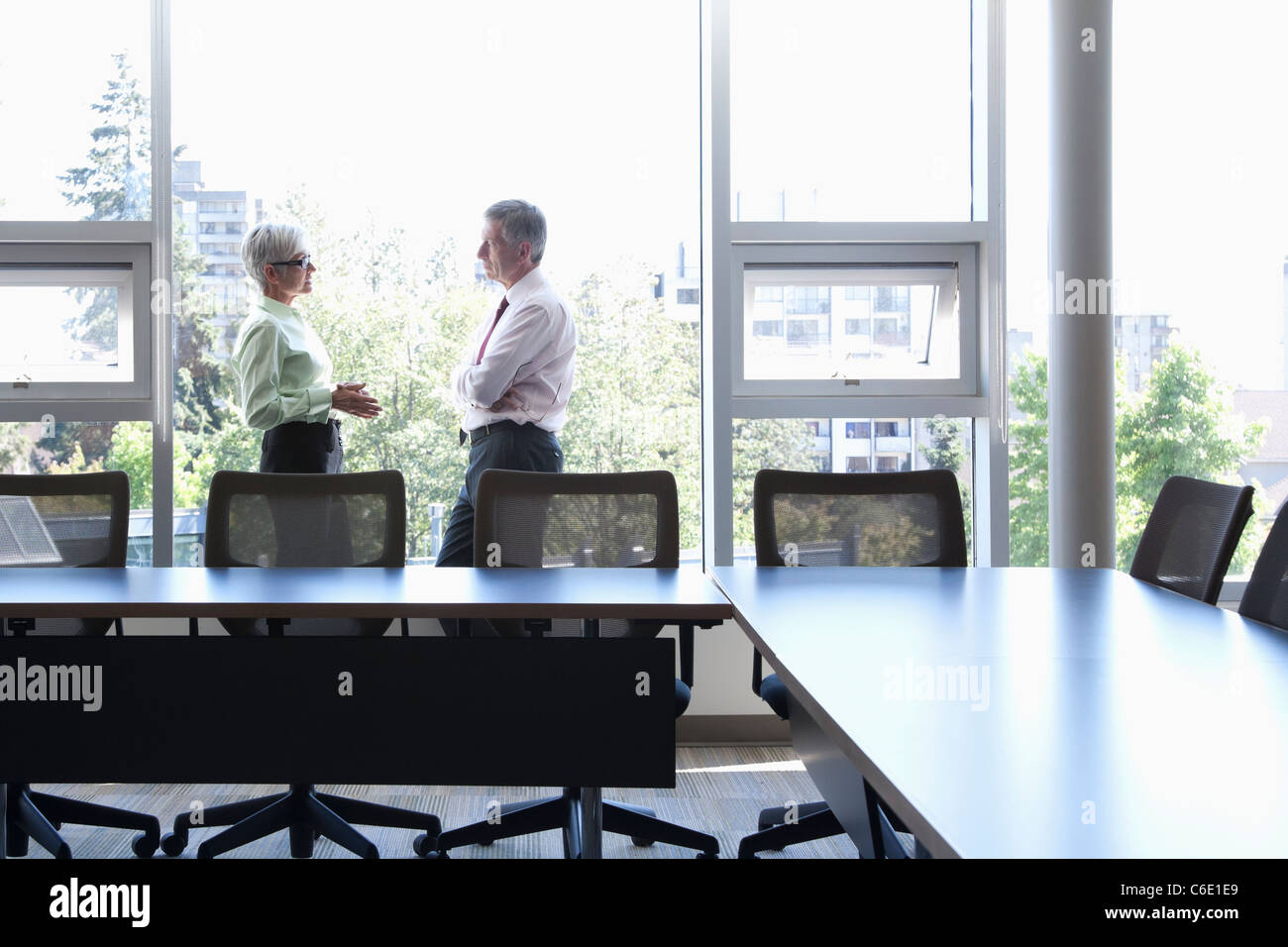 Caucasian business people talking in conference room Banque D'Images