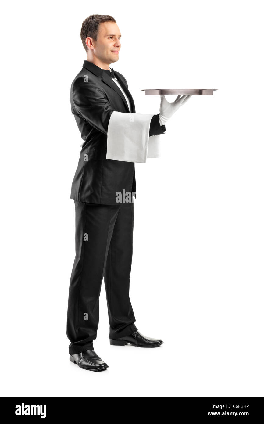 Portrait d'un butler avec papillon transportant un bac vide Banque D'Images