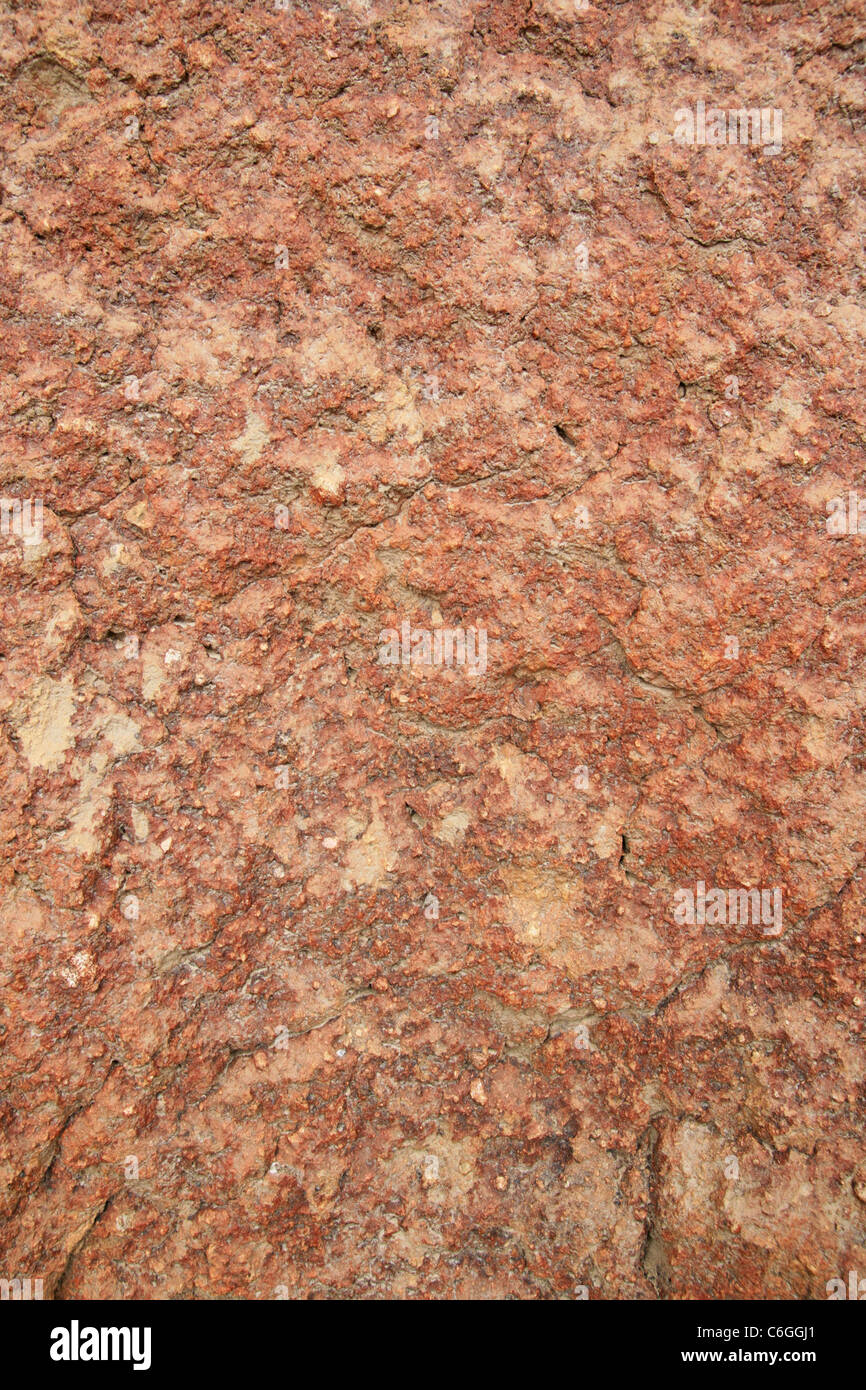 La roche de tuf volcanique rouge grossier de la texture d'arrière-plan Banque D'Images