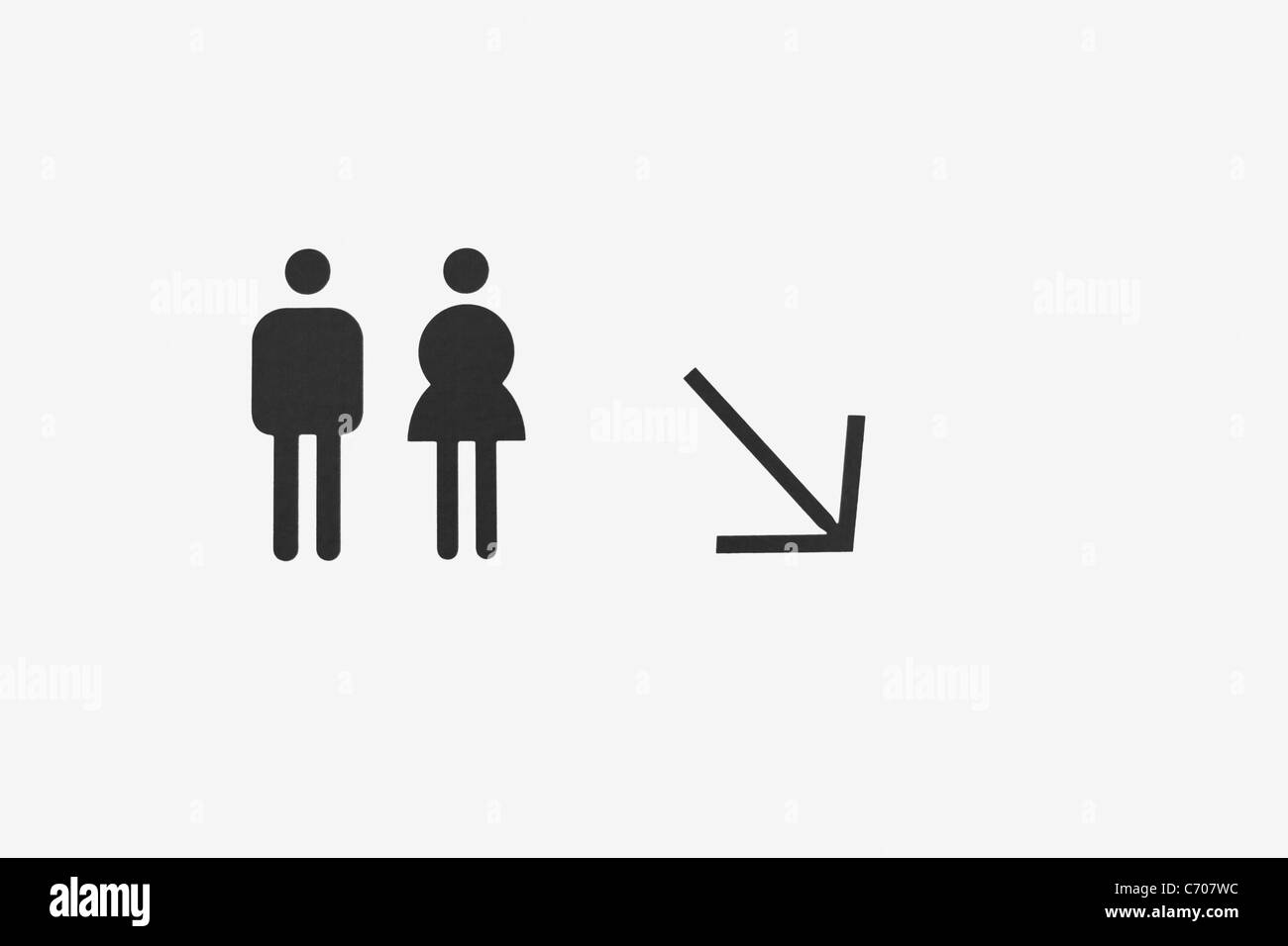 Toilettes signe peint sur un mur Banque D'Images