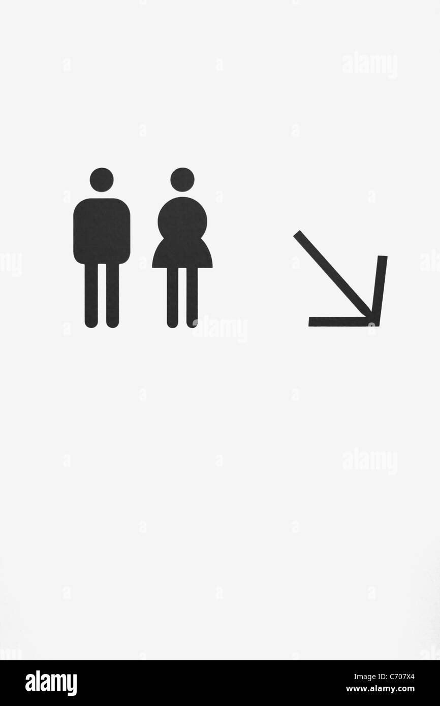 Toilettes signe peint sur un mur Banque D'Images