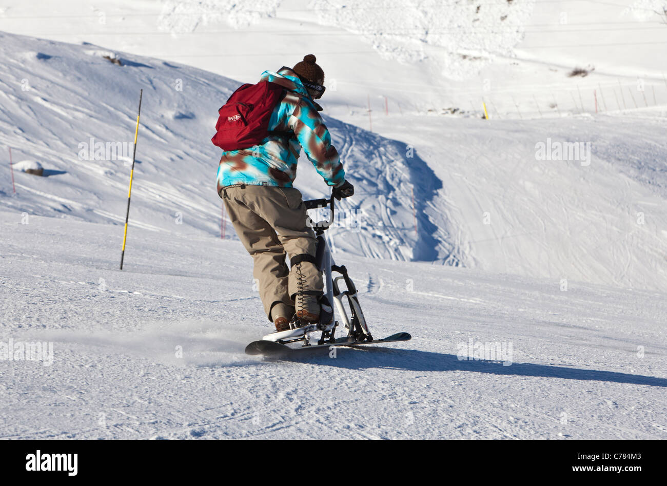 Équitation un scooter de neige, Courchevel 1850, France. Banque D'Images