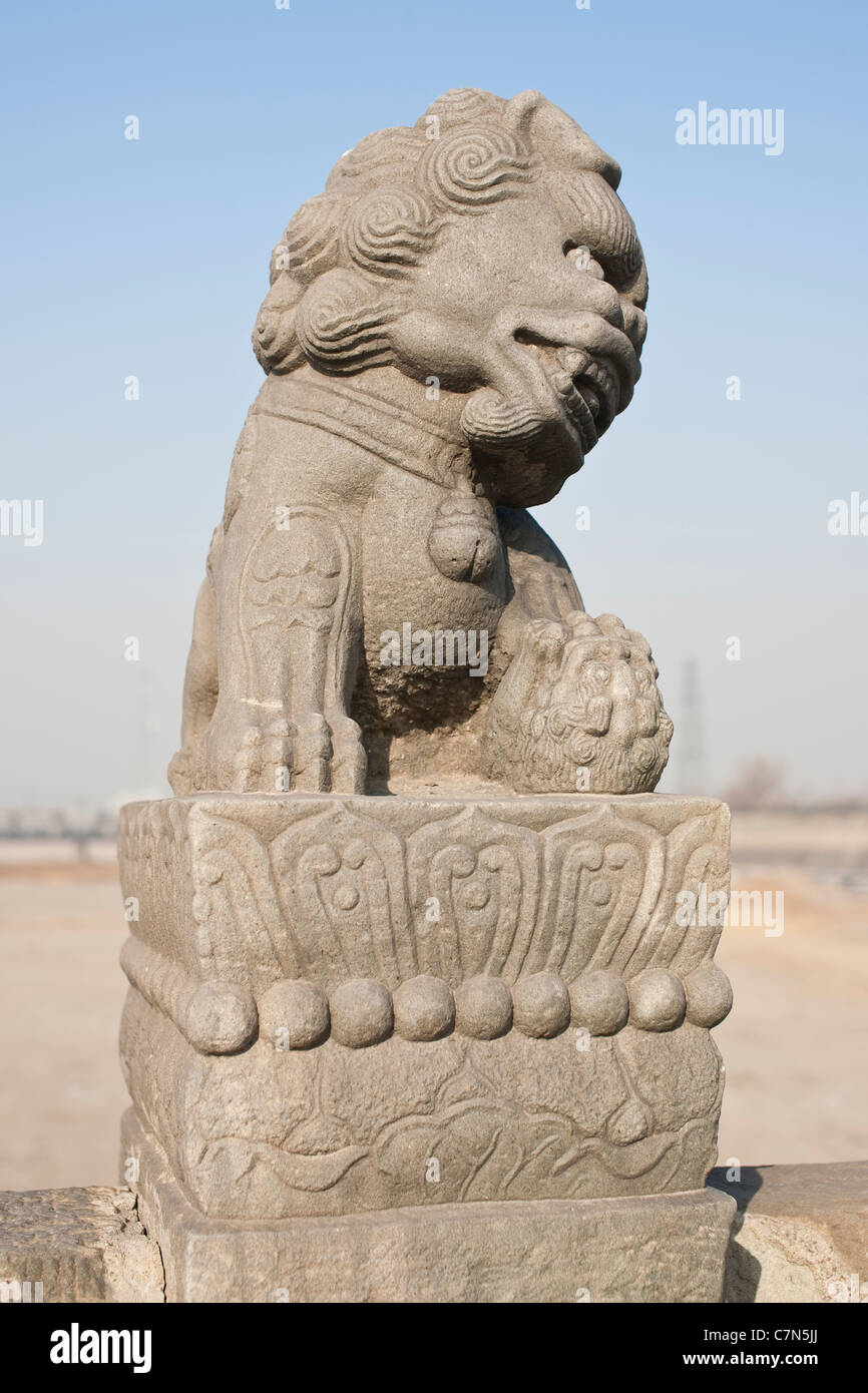 Les lions en pierre sur Lugou Qiao (Marco Polo Bridge) Banque D'Images