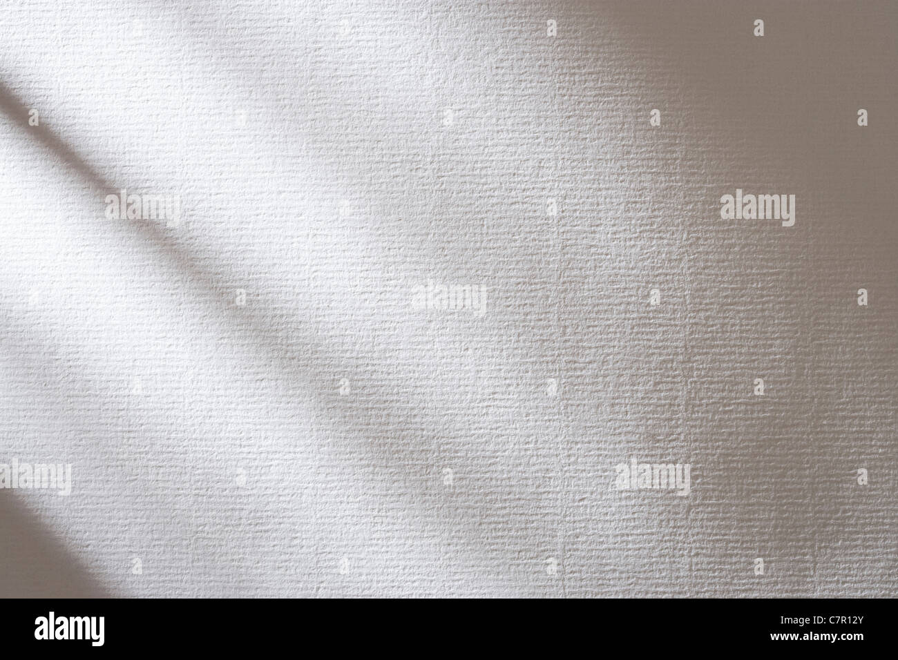 Ombres sur papier blanc texturé. Banque D'Images
