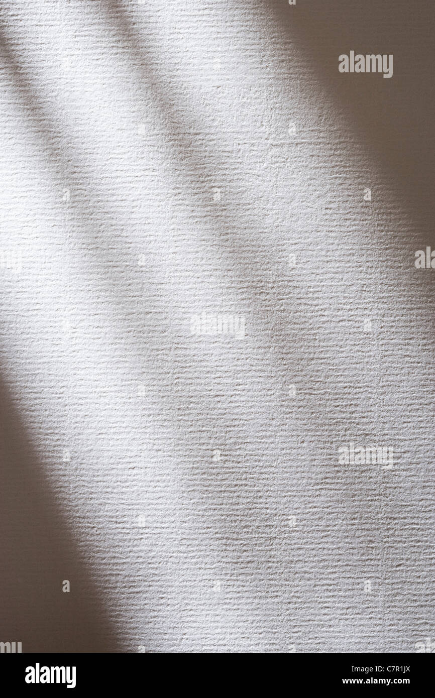 Ombres sur papier blanc texturé. Banque D'Images